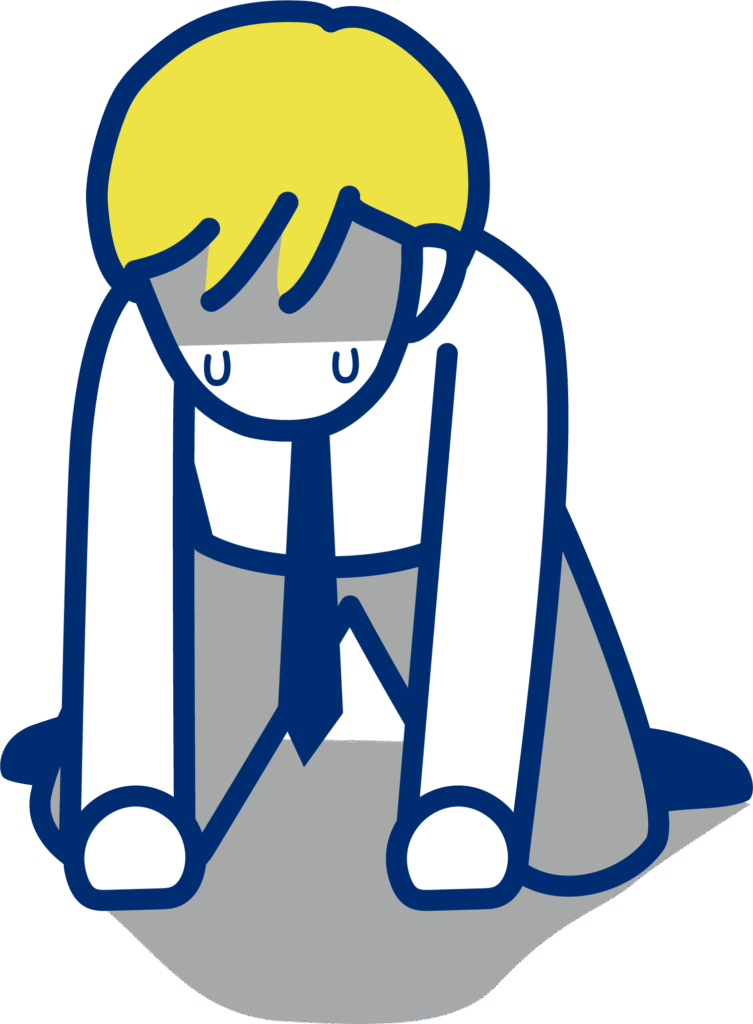 膝をつき落ち込む男性