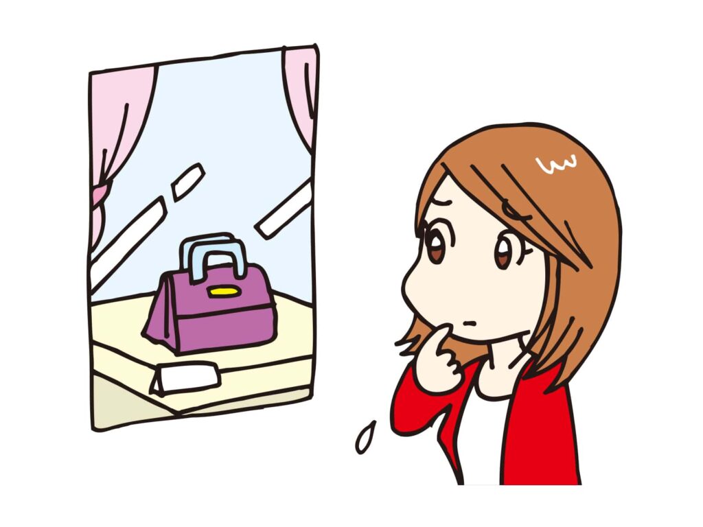 バッグを欲しそうにウインドウを見る女性