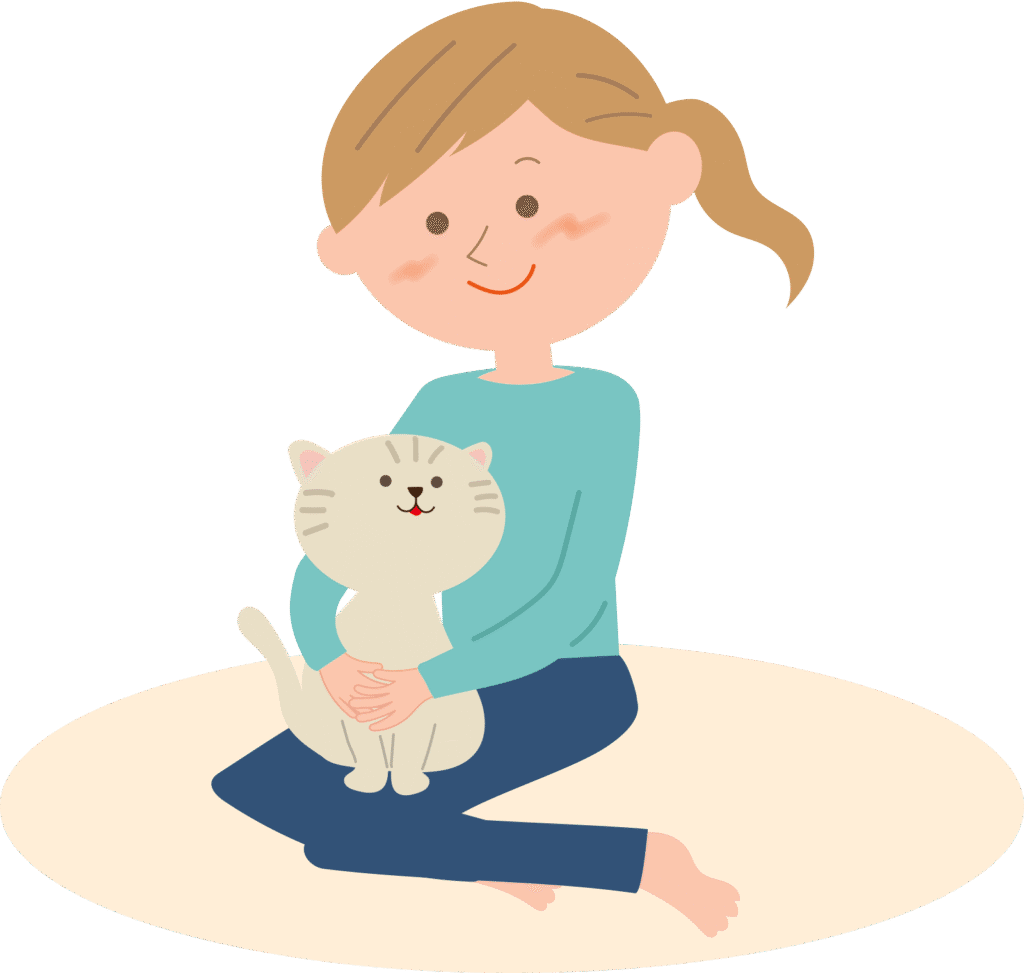 猫を抱きかかえる女性